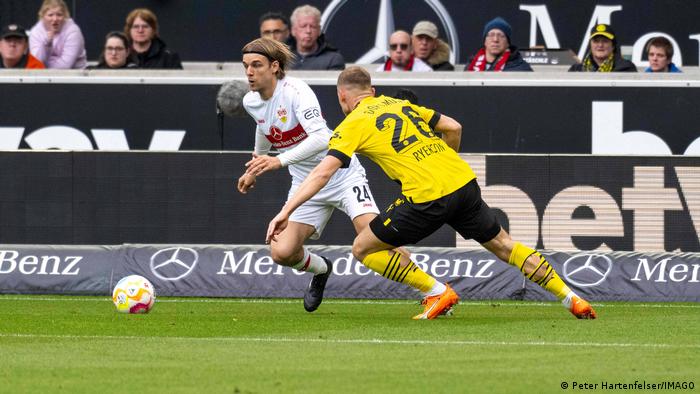 Borna Sosa (left) and VfB Stuttgart secured a point against Borussia Dortmund when they were outnumbered