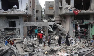 AFP Palestinian children inspect the rubble of destroyed buildings after an Israeli hostage rescue operation in Nuseirat refugee camp, in central Gaza (9 June 2024)