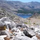 PA Media A direction sign on a rocky path in the hills of Pedi (Pedi centre pictured in the distance, right), a small fishing village in Symi, Greece, pointing toward Agia Marina on 8 June