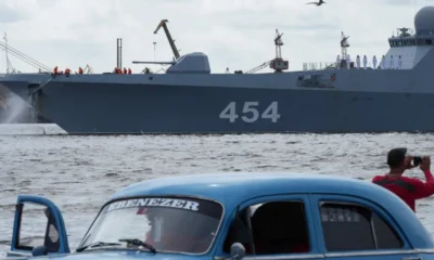 Reuters A man takes pictures of Russian frigate Admiral Gorshkov as it departs from Cuba on Monday