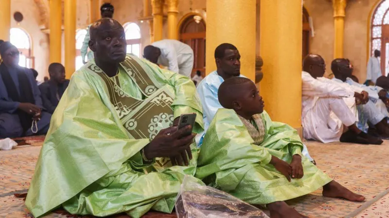 Getty Images People arrive at mosques in Dakar, Senegal for Eid prayer