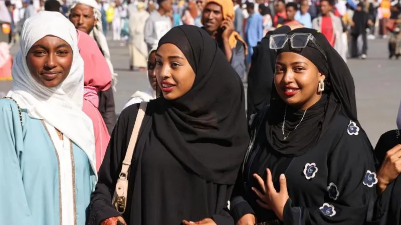 Getty Images Three girls smiling at the camera