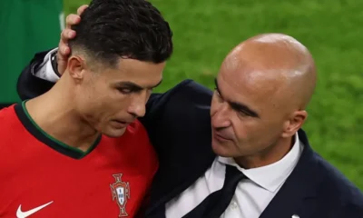 Roberto Martinez hugging Cristiano Ronaldo
