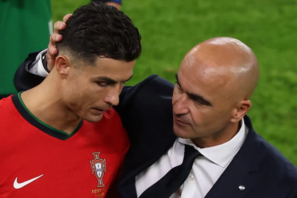 Roberto Martinez hugging Cristiano Ronaldo